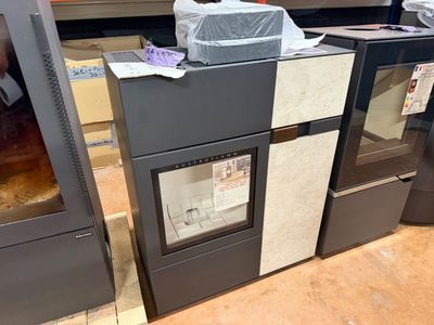 two ovens that are sitting in the middle of the floor