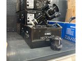 a black camera sitting on top of a box in a store