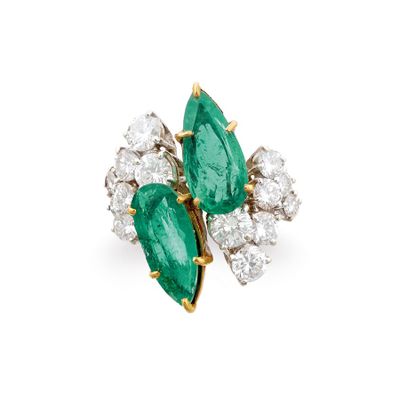 an emerald and diamond cluster ring