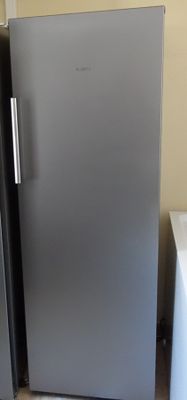 two refrigerators that are next to each other in the kitchen