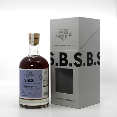 a close up of a bottle of liquor next to a box