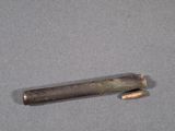 a small piece of metal that is laying on a table