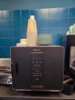 a microwave that is sitting on a counter in a kitchen