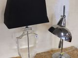 a lamp that is sitting on a table next to a lamp