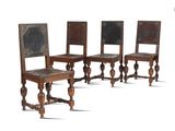 three wooden chairs with a leather seat and a wooden back