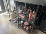a metal shelf with various items on it