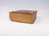an old book that is sitting on a table