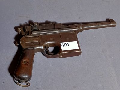 a gun that is on a table with a name tag on it