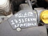 a close up of a car ' s engine with a tag on it
