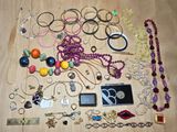 many different types of jewelry on the table