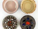 three bowls and a bowl with a red star on them