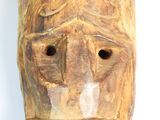 an image of a wooden mask on a white background