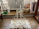 a plant in a basket on a table next to a radiator