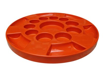 a close up of an orange plastic plate on a white background