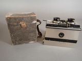 two old cameras sitting next to each other on a table