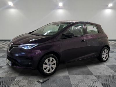 a picture of a purple car parked in a garage