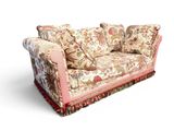 an image of a floral couch with pillows on it