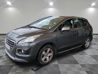 the grey car is parked in the garage on a checkered floor