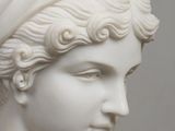 marble bust of a woman with a turban on her head