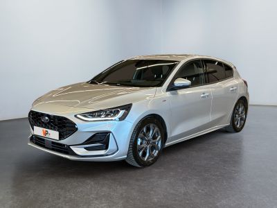 a silver car parked in a white room with a black floor
