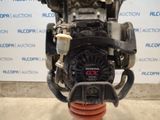 a close up of a motor engine on a stand in front of a wall