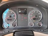 a close up of a car dashboard with various gauges