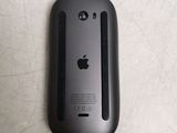 a close up of an apple mouse on a table