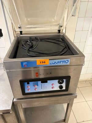 a machine that is sitting on a stand in a kitchen