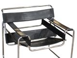 an image of a black leather and chrome chair on a white background