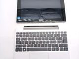 a laptop and a tablet on a white table