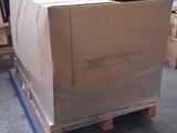 a large box sitting on a pallet in a warehouse