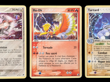 three cards with different designs are shown on a black background