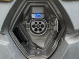 an image of a close up of a car ' s front bumper with a blue light on it