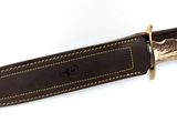 brown leather knife sheath with deer antelope handle on white background