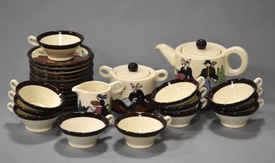 a lot of cups and saucers that are sitting on a table