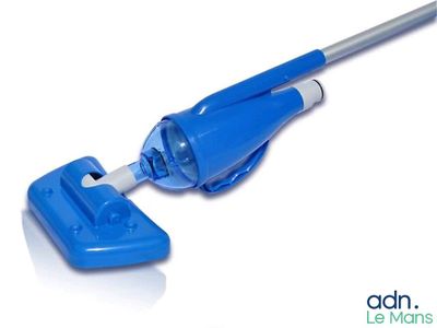 a close up of a blue mop with a handle on a white surface