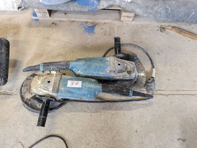 a picture of a pair of electric tools sitting on the floor