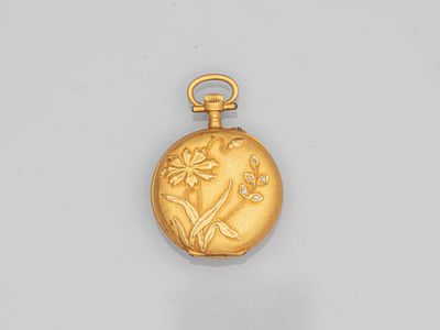 an image of a gold pocket watch with a flower design on it