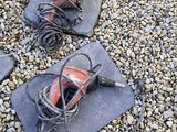 three pairs of shoes that are laying on the ground