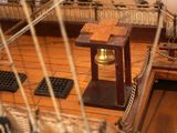 a small bell that is on the side of a ship