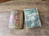 two books sitting on a wooden table next to each other