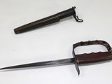 a knife and a knife holder on a table