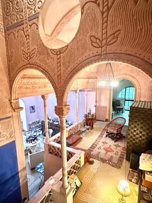 a living room with a lot of furniture inside of it
