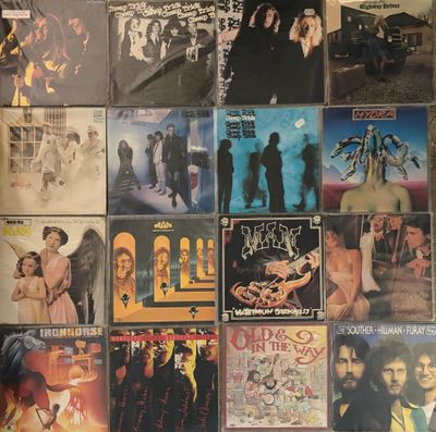 a lot of different album covers on the wall