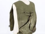 the back of a green backpack on a mannequin stand