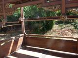 a wooden bench that is in the middle of the woods