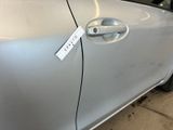 a sticker on the door handle of a car