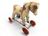 a small toy horse that is sitting on a cart