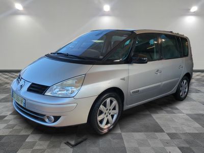 an image of a silver minivan parked in a garage