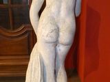 a statue of a woman that is standing in a room
